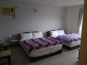 Una cama o camas en una habitación de 內灣星光流域民宿