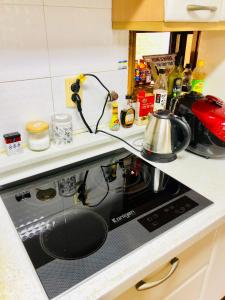 A kitchen or kitchenette at High Street Guest House