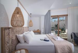 Postel nebo postele na pokoji v ubytování Harma Boutique Hotel