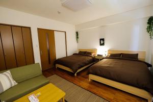 Postel nebo postele na pokoji v ubytování Yomitan Ocean View Apartment 402