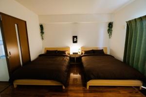Postel nebo postele na pokoji v ubytování Yomitan Ocean View Apartment 402