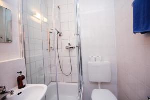 Koupelna v ubytování Hotel Olympia