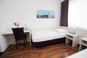 Postel nebo postele na pokoji v ubytování Hotel Olympia