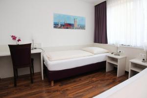 Postel nebo postele na pokoji v ubytování Hotel Olympia