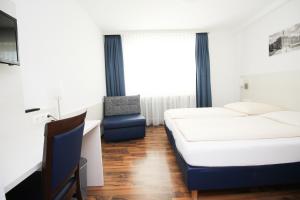 Postel nebo postele na pokoji v ubytování Hotel Olympia