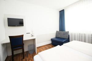 Postel nebo postele na pokoji v ubytování Hotel Olympia