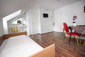Postel nebo postele na pokoji v ubytování Hotel Olympia