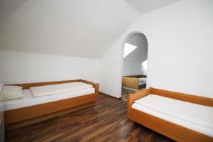 Postel nebo postele na pokoji v ubytování Hotel Olympia