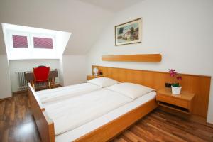 Postel nebo postele na pokoji v ubytování Hotel Olympia