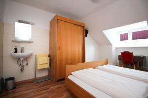 Postel nebo postele na pokoji v ubytování Hotel Olympia