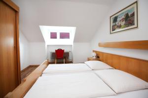 Postel nebo postele na pokoji v ubytování Hotel Olympia