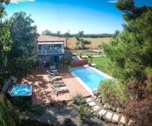 an aerial view of a house with a swimming pool at Villa Alyzea in Bessan