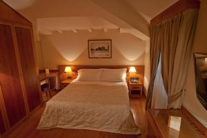 Letto o letti in una camera di Albergo Celide