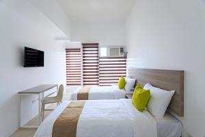 Postel nebo postele na pokoji v ubytování Eon Centennial Soho Hotel