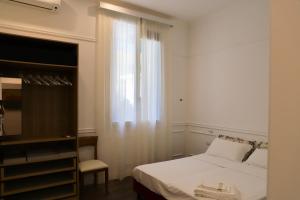 Ein Bett oder Betten in einem Zimmer der Unterkunft Promenade Maison de Charme