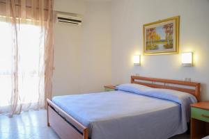 Postel nebo postele na pokoji v ubytování Hotel Eden