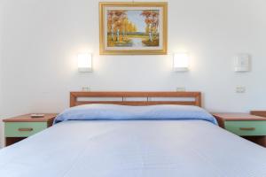 Postel nebo postele na pokoji v ubytování Hotel Eden