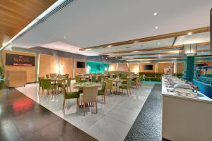 A restaurant or other place to eat at Al Khoory Executive Hotel, Al Wasl