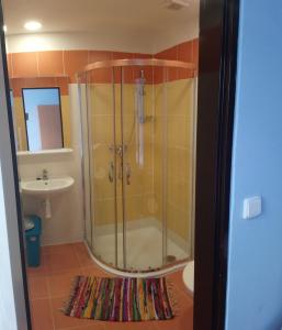 a bathroom with a shower and a sink at Lucky apartmán in Svoboda nad Úpou