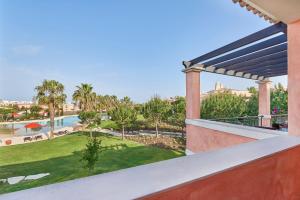 a view of the pool from the balcony of a house at Cascade Wellness Resort in Lagos