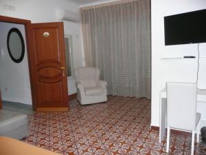 TV a/nebo společenská místnost v ubytování Garden House Ercolano