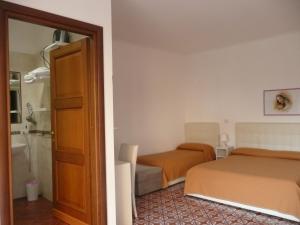 Postel nebo postele na pokoji v ubytování Garden House Ercolano