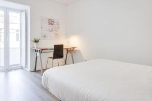 Säng eller sängar i ett rum på 2bed in Central Lisbon
