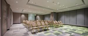 a conference room with a row of chairs in it at MaxOne Platinum Hayam Wuruk in Jakarta