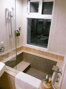 Vannituba majutusasutuses Hua Ge Hot Spring Hotel