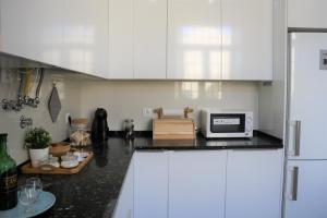 Kuchyň nebo kuchyňský kout v ubytování Jardim das Amoreiras Central Apartment