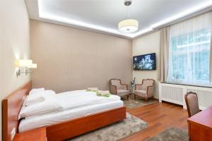 Giường trong phòng chung tại CityPark Deluxe Apartment