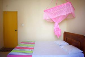 Postel nebo postele na pokoji v ubytování Yaswi Guest House