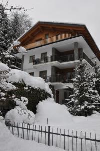 a snow covered house with a fence in front of it at Casa Herin-La borna du Tésòn - CIR VDA - VALTOURNENCHE - n 0254 in Valtournenche