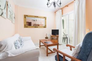 a living room with a couch and a table at Apartamento SAMU 1 in Cala Ratjada