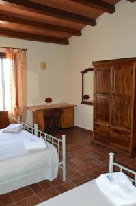 A bed or beds in a room at Casa vacanza Borgo Parrini