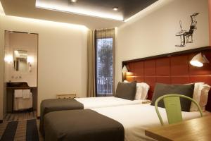 Hotel Aulivia Opéra 객실 침대