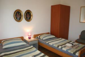 Postel nebo postele na pokoji v ubytování Apartmani Halilovic