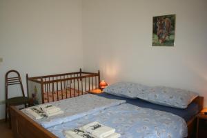Postel nebo postele na pokoji v ubytování Apartmani Halilovic