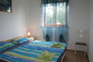 Postel nebo postele na pokoji v ubytování Apartmani Halilovic