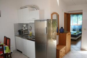 Kuchyň nebo kuchyňský kout v ubytování Apartmani Halilovic