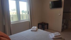 Postel nebo postele na pokoji v ubytování Hotel Castellverd