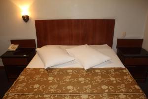 Postel nebo postele na pokoji v ubytování Hostal Bond