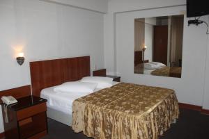 Postel nebo postele na pokoji v ubytování Hostal Bond