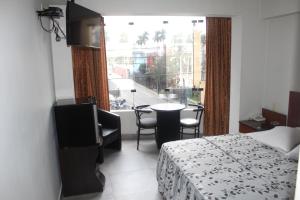 Postel nebo postele na pokoji v ubytování Hostal Bond