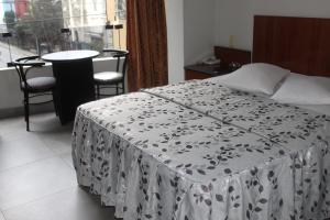Postel nebo postele na pokoji v ubytování Hostal Bond