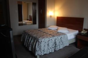 Postel nebo postele na pokoji v ubytování Hostal Bond