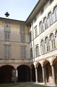 a building with a clock on the side of it at bnb Bergamo in Bergamo