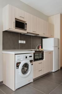 A kitchen or kitchenette at Stylish Suites, The Luxury Suites