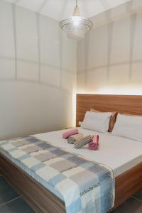 En eller flere senge i et værelse på Stylish Suites, The Luxury Suites