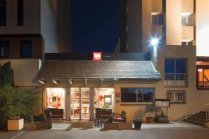 a building with a sign on the front of it at ibis Châtellerault in Châtellerault